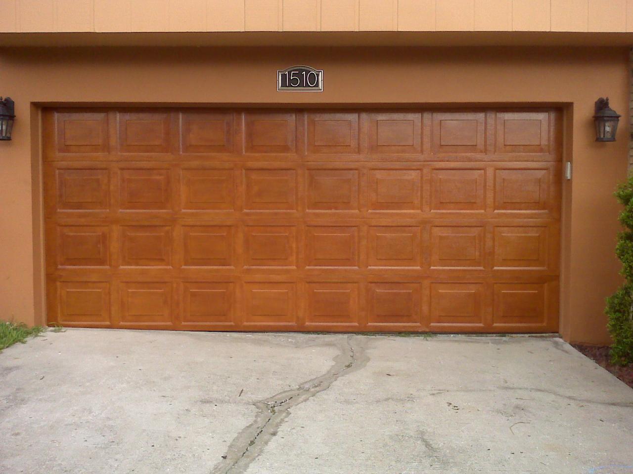 Garage door refinished with a faux wood grain stain